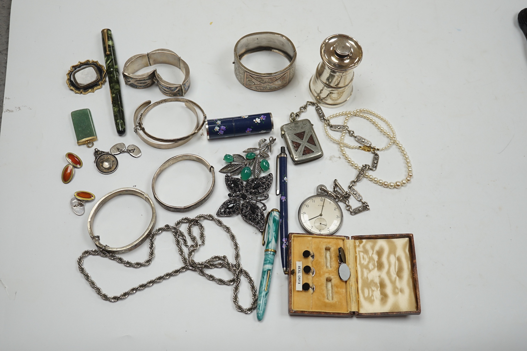 A mixed group of items including silver, white metal and costume jewellery, silver vesta case, silver mounted pepper mill, pens, Victorian mourning brooch, dress pocket watch, etc. Condition - poor to fair